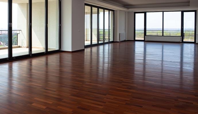 Professional wood floor cleaning service Shiny clean and polished wood floor after professional cleaning