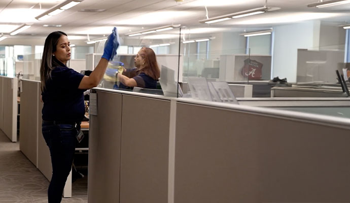 Office room cleaning service A Professional cleaning an office room