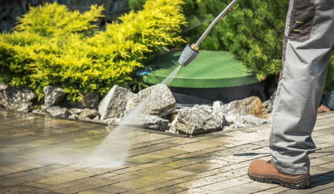 Professional concrete surface pressure washing service Professional pressure washing of concrete surface for thorough cleaning