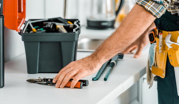 Professional handyman repair and maintenance service Skilled handyman providing home repair and maintenance services