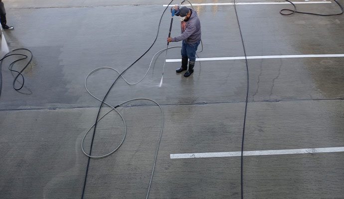 Professional parking lot cleaning service Professional parking lot cleaning using specialized cleaning equipment